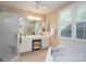 Bright bathroom featuring double vanity, soaking tub, and glass enclosed shower at 258 Patterson'S Bridge None, New London, NC 28127