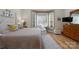 Sunlit bedroom with hardwood floors, bay windows, and comfortable seating at 258 Patterson'S Bridge None, New London, NC 28127