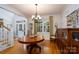 Elegant dining room featuring hardwood floors, a classic chandelier, and ample natural light at 258 Patterson'S Bridge None, New London, NC 28127