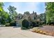 Well-maintained home with stone accents, attached garage, and lush landscaping, showcasing curb appeal and charm at 258 Patterson'S Bridge None, New London, NC 28127