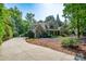 Charming two-story home with stone accents, landscaped yard, and a circular driveway, showcasing curb appeal at 258 Patterson'S Bridge None, New London, NC 28127