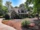 Two-story home featuring stone accents, lush landscaping, and a well-manicured front yard creating a welcoming entrance at 258 Patterson'S Bridge None, New London, NC 28127