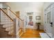 Spacious foyer with hardwood floors, staircase, and view to a cozy sitting room at 258 Patterson'S Bridge None, New London, NC 28127