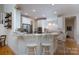 Bright kitchen with stainless steel appliances and breakfast bar seating, perfect for casual dining at 258 Patterson'S Bridge None, New London, NC 28127