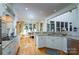 Spacious kitchen with white cabinets, granite countertops, and an adjacent breakfast nook with scenic views at 258 Patterson'S Bridge None, New London, NC 28127