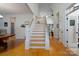 Elegant staircase with hardwood floors and white railings, connecting to spacious living areas at 258 Patterson'S Bridge None, New London, NC 28127
