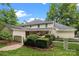 Backyard view of home highlighting the manicured landscaping and charming iron fence at 2709 Wamath Dr, Charlotte, NC 28210