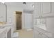 Bright bathroom featuring shower stall, cabinets, sink, and tile flooring at 2709 Wamath Dr, Charlotte, NC 28210