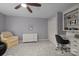 Bedroom features built-in shelving, neutral paint color, and comfortable armchair at 2709 Wamath Dr, Charlotte, NC 28210