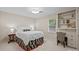 Comfortable bedroom with built-in shelves and a decorative bed frame at 2709 Wamath Dr, Charlotte, NC 28210