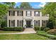 Stately two-story home featuring a well-maintained lawn, walkway, and symmetrically placed windows with black shutters at 2709 Wamath Dr, Charlotte, NC 28210