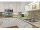 Kitchen featuring granite countertops, stainless steel appliances, and white cabinetry at 2709 Wamath Dr, Charlotte, NC 28210