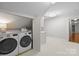 Convenient laundry area with large washer and dryer and storage space at 2709 Wamath Dr, Charlotte, NC 28210
