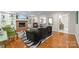 Cozy living room with hardwood floors, a zebra rug, fireplace with white built-ins, and stylish decor at 2709 Wamath Dr, Charlotte, NC 28210