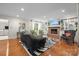 Inviting living room featuring hardwood floors, fireplace with built-ins, zebra rug, and modern decor at 2709 Wamath Dr, Charlotte, NC 28210