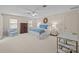 Spacious main bedroom featuring a ceiling fan, carpet, and natural lighting from two windows at 2709 Wamath Dr, Charlotte, NC 28210