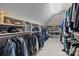Walk-in closet featuring shelving, hanging rods, and carpet flooring at 2709 Wamath Dr, Charlotte, NC 28210
