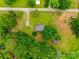 Overhead view of property showcasing the house, surrounding greenery, and layout of the land with driveway and outbuildings at 2921 Ambrose Dr, Gastonia, NC 28056