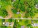 Birds eye view of home with surrounding trees, sheds, driveways and neighboring homes at 2921 Ambrose Dr, Gastonia, NC 28056