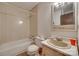 A bathroom featuring tile, a vanity sink, a standard toilet, and a bathtub with shower at 2921 Ambrose Dr, Gastonia, NC 28056