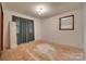 A bedroom featuring unfinished floors and simple fixtures, ready for customization at 2921 Ambrose Dr, Gastonia, NC 28056