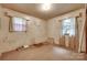 Bedroom with old carpet, a single window, and deferred maintenance visible on the walls at 2921 Ambrose Dr, Gastonia, NC 28056