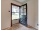 An open entryway shows an open front door with a view to the exterior and unfinished flooring at 2921 Ambrose Dr, Gastonia, NC 28056