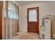 A small laundry room with an aging hot water heater and a wooden door at 2921 Ambrose Dr, Gastonia, NC 28056