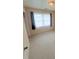 Bright bedroom with soft carpeting, neutral walls, and a window with sheer curtains at 300 N Watterson St, Kings Mountain, NC 28086