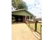 Beautiful brick home featuring a convenient carport and a well-maintained lawn enclosed by a stylish fence, offering comfort and curb appeal at 300 N Watterson St, Kings Mountain, NC 28086