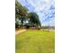 Quaint single-story brick home with a fenced yard and mature trees, creating a picturesque and inviting curb appeal on a spacious lot at 300 N Watterson St, Kings Mountain, NC 28086