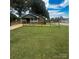 Charming home features a well-manicured lawn, surrounded by a neat fence under a partly cloudy sky at 300 N Watterson St, Kings Mountain, NC 28086