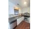 Functional kitchen with stainless steel appliances, neutral countertops and white cabinets at 300 N Watterson St, Kings Mountain, NC 28086