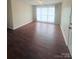 Bright living room with hardwood flooring and large windows offering plenty of natural light at 300 N Watterson St, Kings Mountain, NC 28086