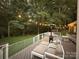 Expansive deck with outdoor seating and a heater, overlooking a well-maintained backyard with mature trees at 3314 Mara Ct, Matthews, NC 28105