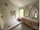 Bright bathroom featuring a glass-enclosed shower, dual sinks, and elegant finishes, creating a spa-like retreat at 3314 Mara Ct, Matthews, NC 28105