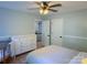 Light-filled bedroom with a white dresser, baby crib, and neutral decor, creating a serene atmosphere at 3314 Mara Ct, Matthews, NC 28105