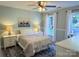 Cozy bedroom with natural light, complemented by two bedside lamps and a tranquil color palette at 3314 Mara Ct, Matthews, NC 28105