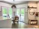 Bright breakfast nook with French doors leading to a deck and featuring a stylish round dining table at 3314 Mara Ct, Matthews, NC 28105
