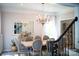 Elegant dining room with a classic chandelier, neutral paint, and ample seating for formal gatherings at 3314 Mara Ct, Matthews, NC 28105