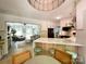 Open-concept kitchen featuring quartz countertops, barstool seating, and views into the living room and backyard at 3314 Mara Ct, Matthews, NC 28105