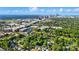 Expansive aerial view of a city skyline amidst lush greenery and vibrant urban development at 343 Melbourne Ct, Charlotte, NC 28209