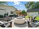 Outdoor firepit area surrounded by comfortable Adirondack chairs in a well-maintained backyard at 343 Melbourne Ct, Charlotte, NC 28209
