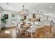 Elegant dining area with modern lighting fixtures and a seamless transition to the kitchen at 343 Melbourne Ct, Charlotte, NC 28209