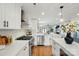 Bright kitchen featuring stainless appliances, quartz counters and herringbone backsplash at 343 Melbourne Ct, Charlotte, NC 28209
