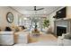 Comfortable living room with fireplace, large sectional sofa, and doors leading to the yard at 343 Melbourne Ct, Charlotte, NC 28209