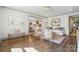Bright living room with hardwood floors, comfortable seating, and an open view to dining area at 343 Melbourne Ct, Charlotte, NC 28209