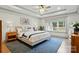 Cozy bedroom with tray ceiling, large window, and a blue accent rug at 343 Melbourne Ct, Charlotte, NC 28209