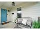Cozy porch featuring a black bench, decorative pillows, and plants for an inviting entrance at 343 Melbourne Ct, Charlotte, NC 28209