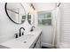 Modern bathroom features dual sinks, sleek fixtures, and a shower with classic subway tile at 3615 Kempton Pl, Charlotte, NC 28208